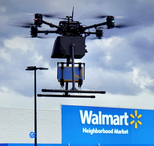 A DroneUp drone delivering over a Walmart Neighborhood Market